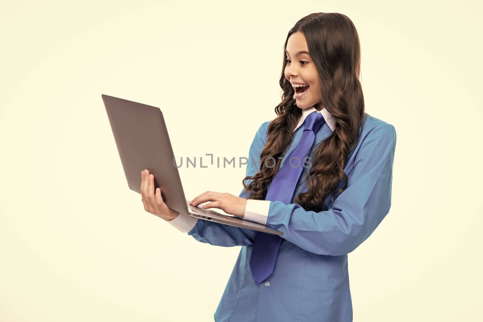 Student school girl with laptop on isolated studio background. Video online webinar, learn on laptop, elearning lesson, pc computer call