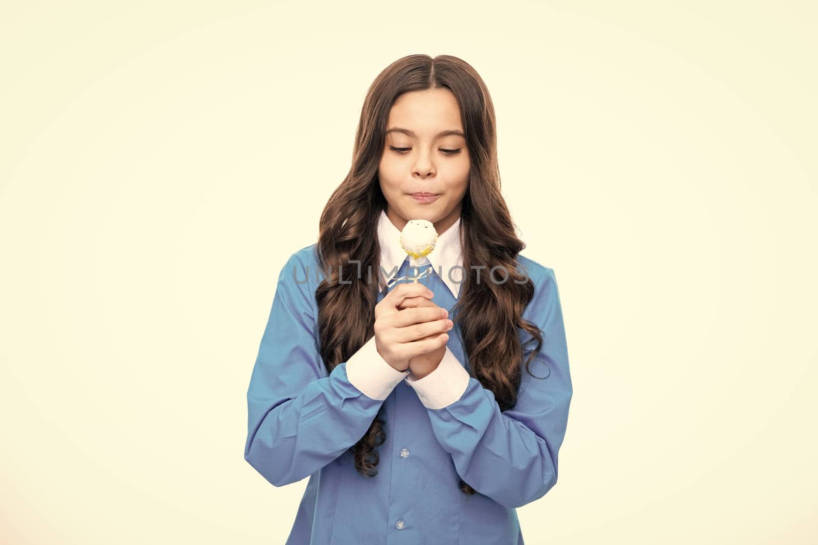 Teen girl hold lollipop caramel on white isolated background, candy shop. Teenager with sweets suckers. by RedFoxStudio