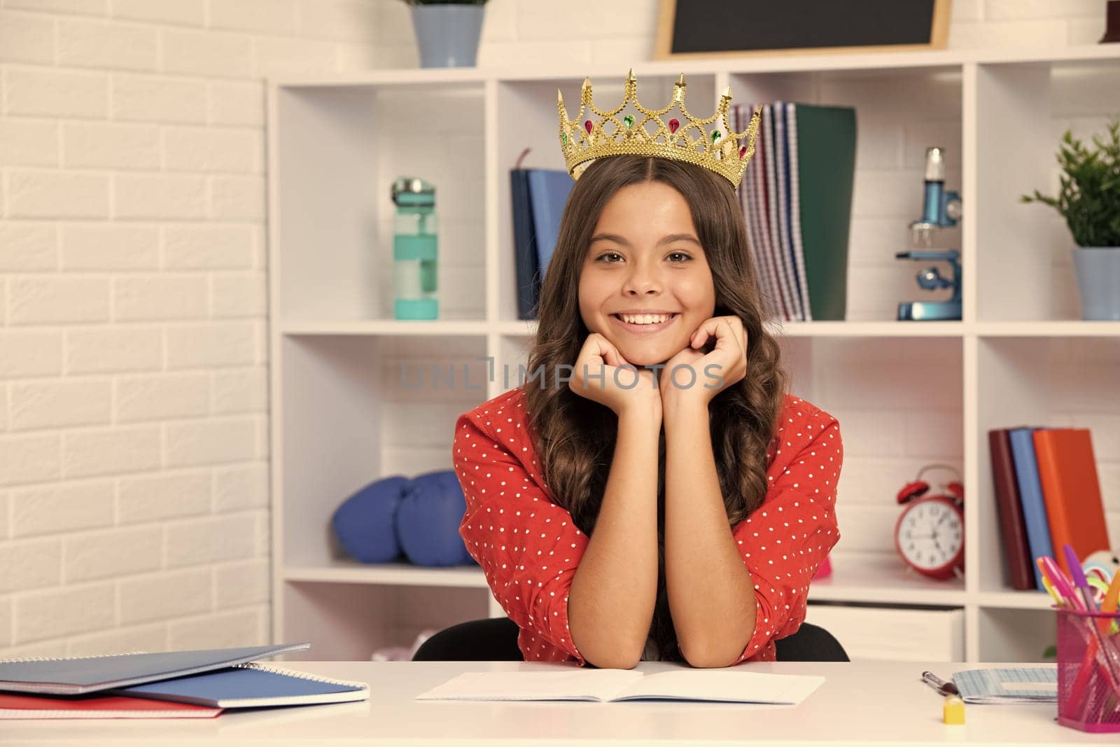 Princess school girl. Teenager princess child celebrates success win and victory. Teen girl in queen crown. Happy girl smiling