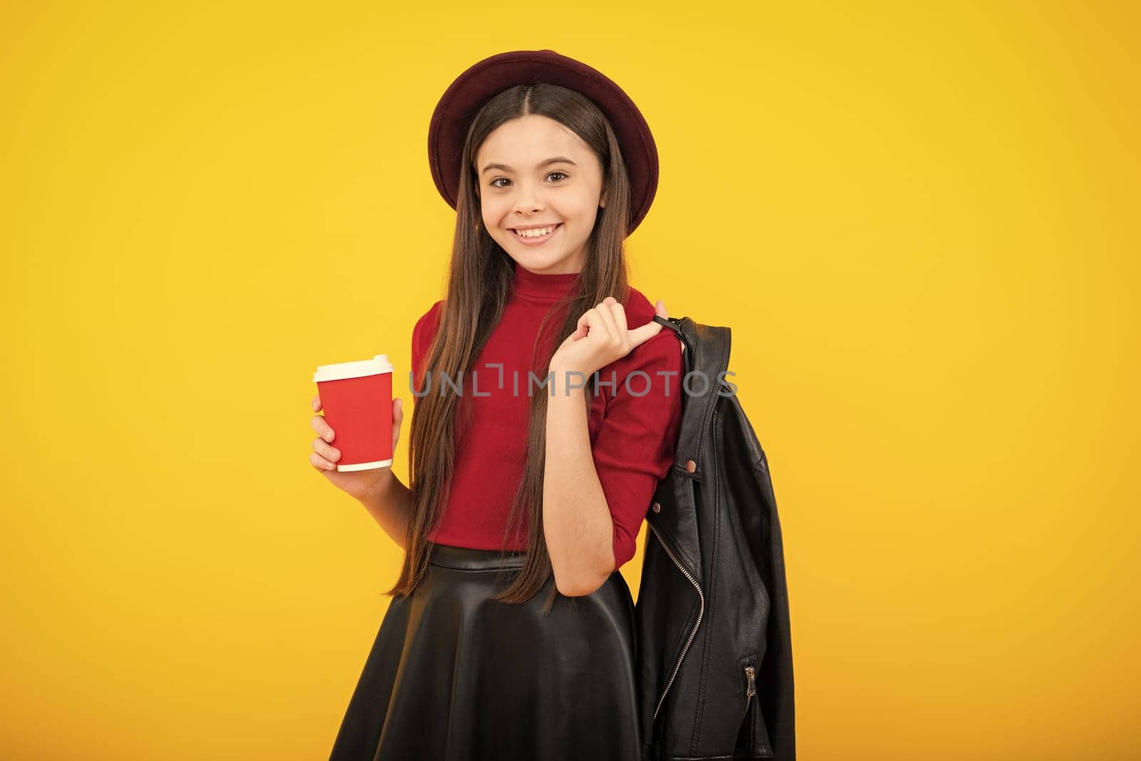 Fashion school girl holding coffee cup, learning and education. Coffee break and school recess. Back to school. Teenager student plastic takeaway cup drink cocoa or tea beverage