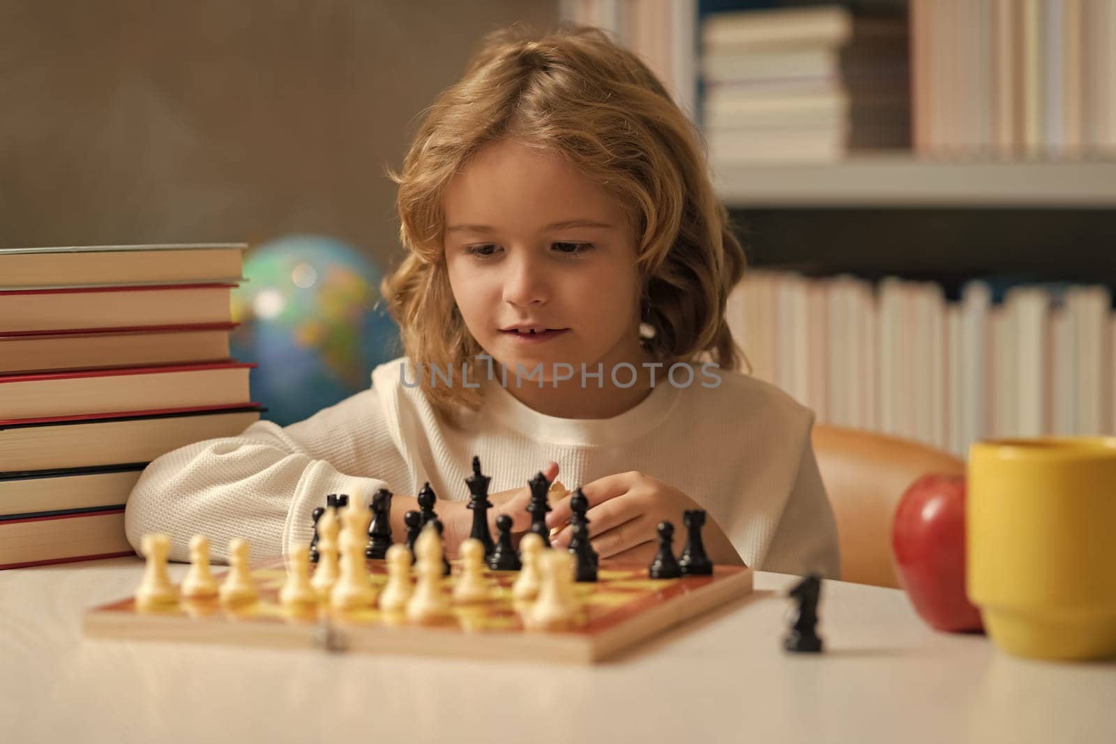 Early development. Boy thinking about chess. The concept of learning and growing children. Chess, success and winning. Games good for brain intelligence concept. by RedFoxStudio