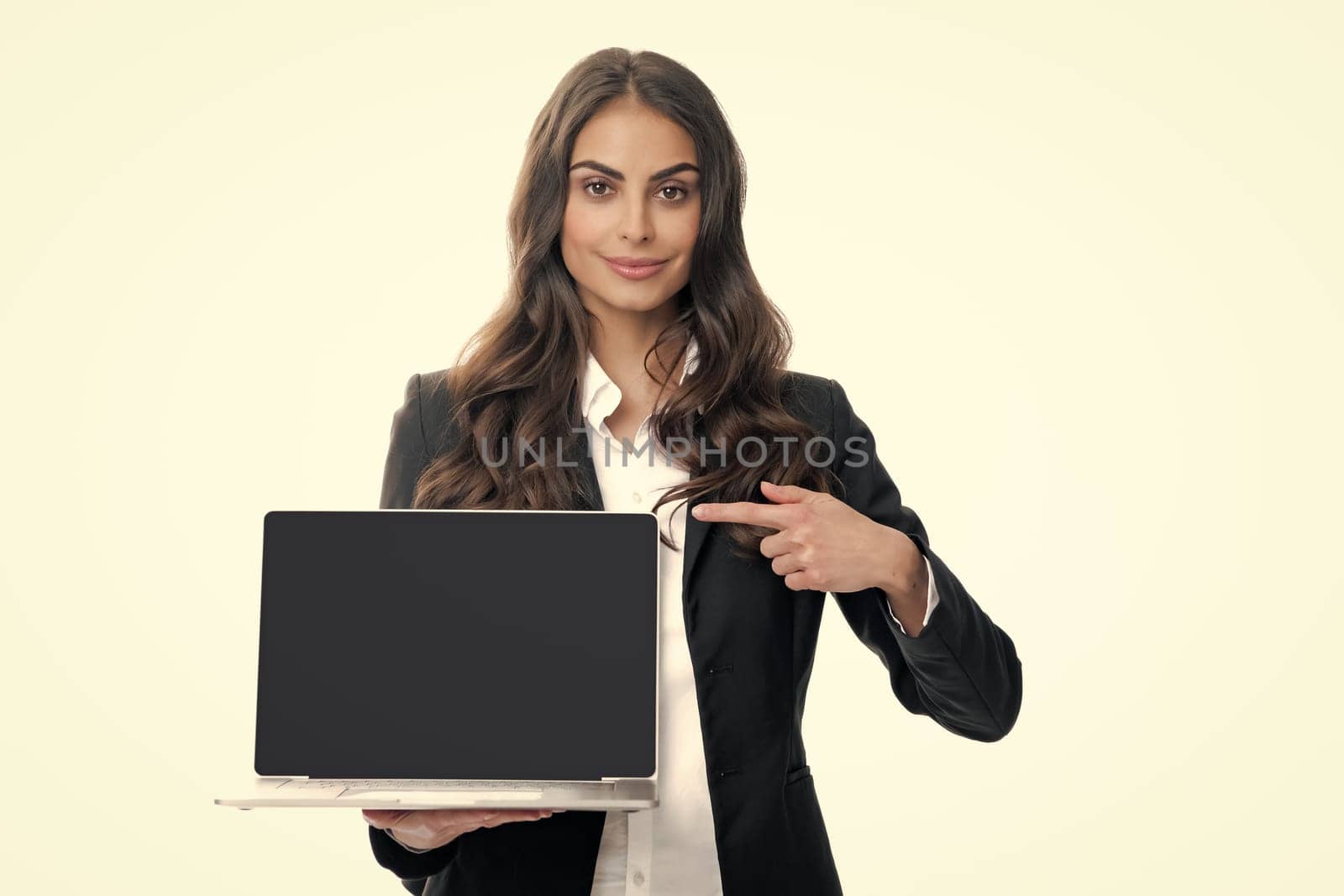 Woman holding laptop with empty mock up screen for copy space. Portrait of college student with laptop. Woman working on laptop, freelance