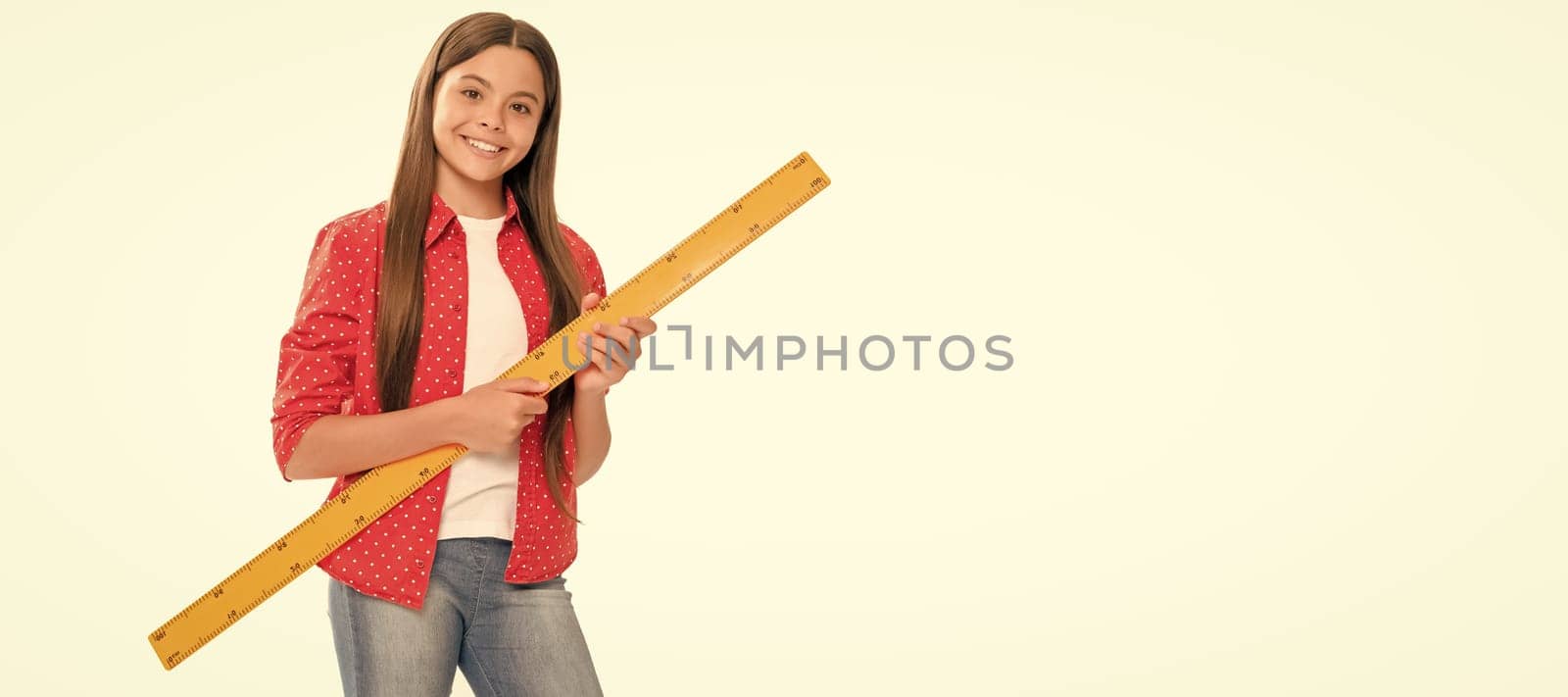 happy teen girl hold ruler study math at school isolated on white. Portrait of schoolgirl student, studio banner header. School child face, copyspace. by RedFoxStudio