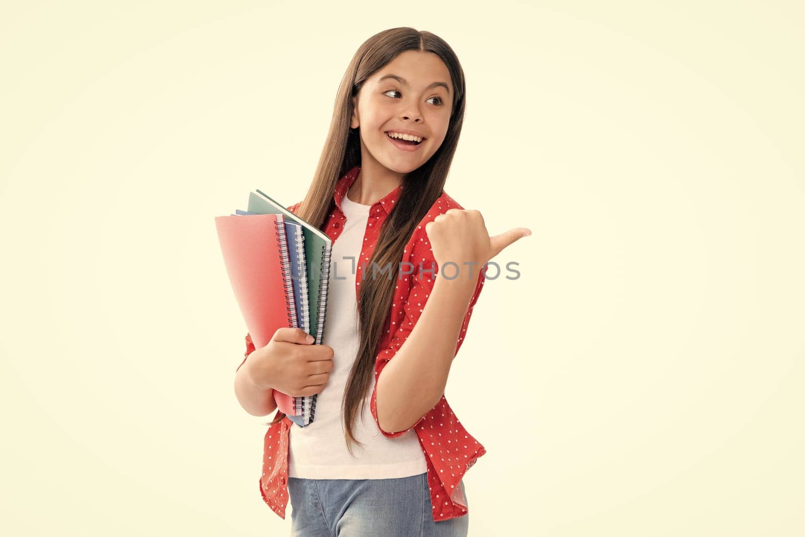 Teen girl pupil hold books, notebooks, isolated on white background, copy space. Back to school, teenage lifestyle, education and knowledge. Portrait of happy smiling teenage child girl. by RedFoxStudio