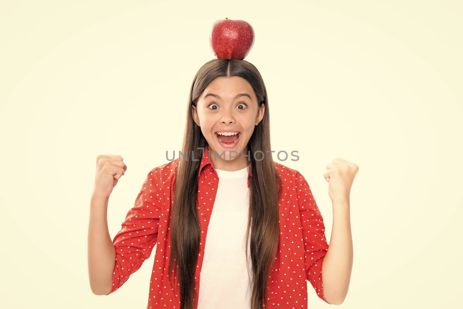 Portrait of confident teen girl with apple going to have healthy snack. Health, nutrition, dieting and kids vitamins. Portrait of emotional amazed excited teen girl. by RedFoxStudio