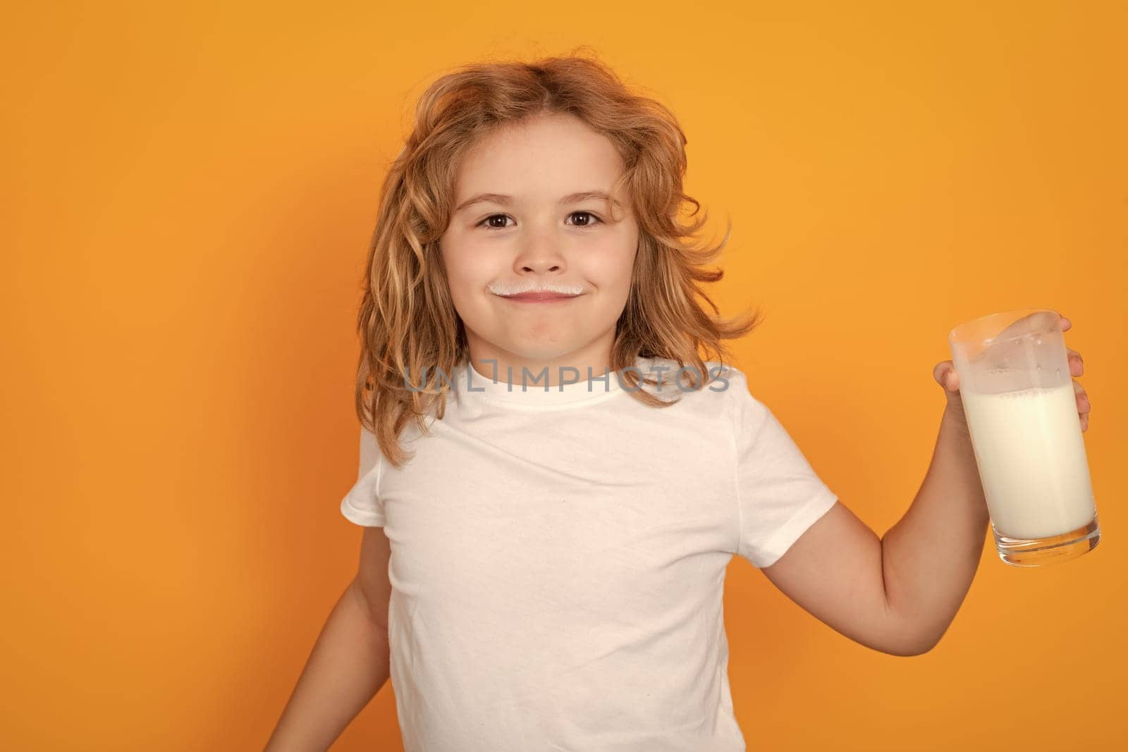 Cute child drinking milk on yellow background. by RedFoxStudio