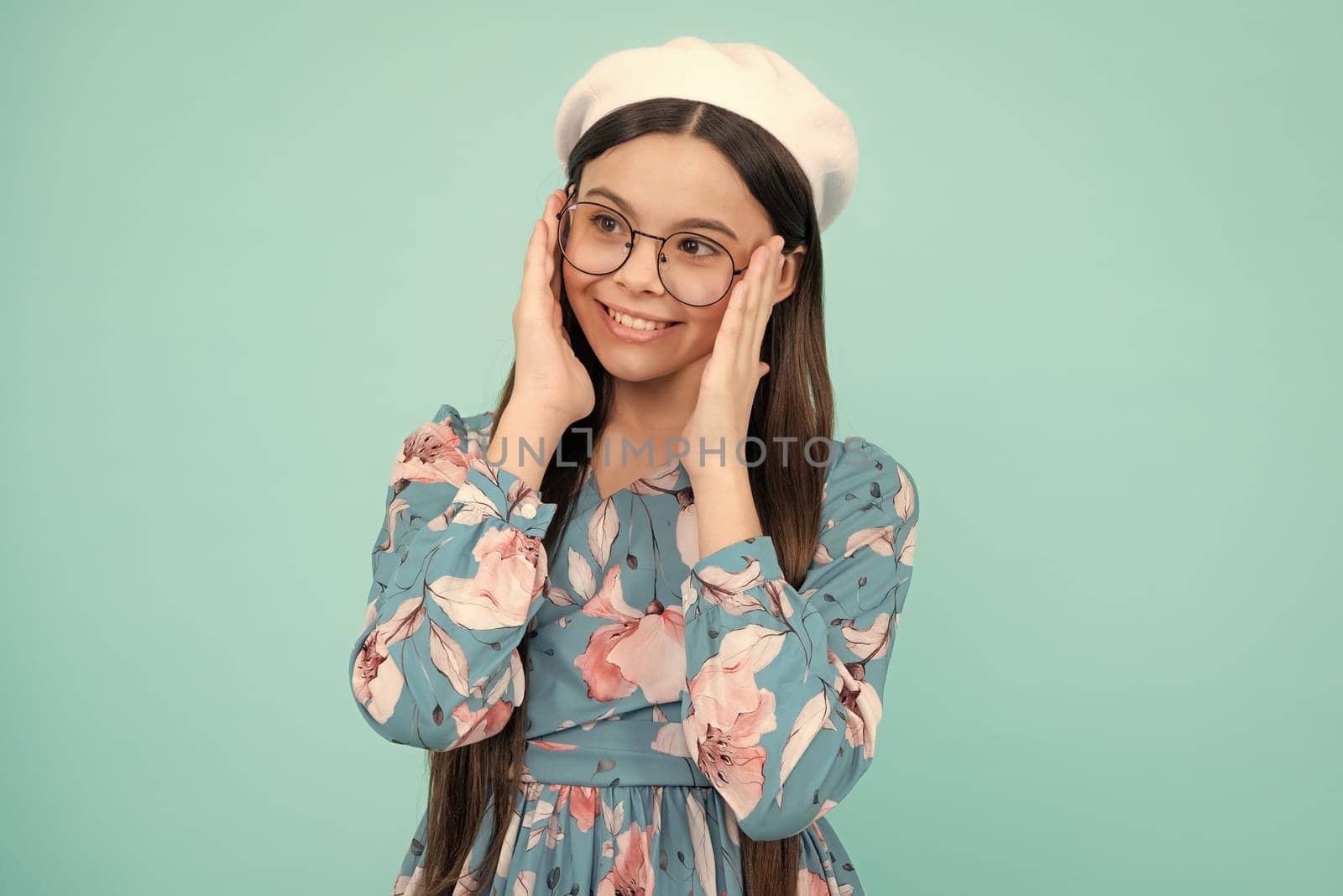 Happy teenager, positive and smiling emotions. Little kid girl 12,13, 14 years old on isolated background. Children studio portrait. Emotional kids face