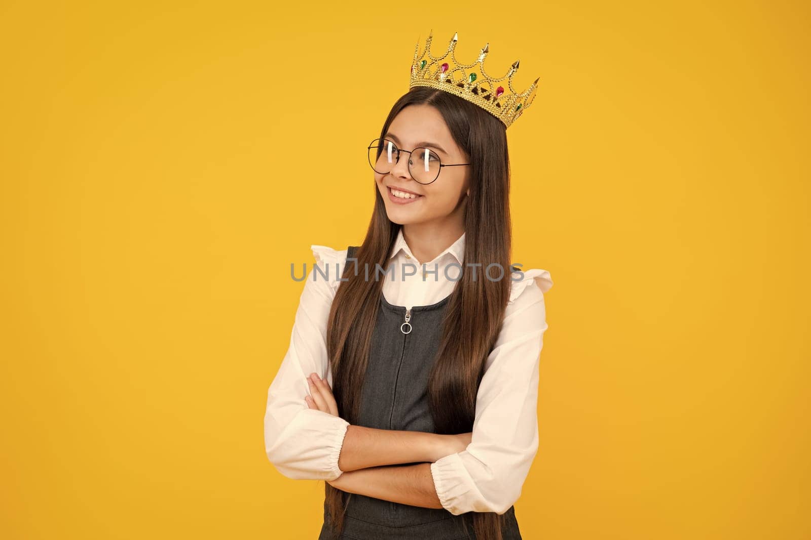 Beauty teen girl queen wear crown. Child in princess diadem. Happy girl face, positive and smiling emotions