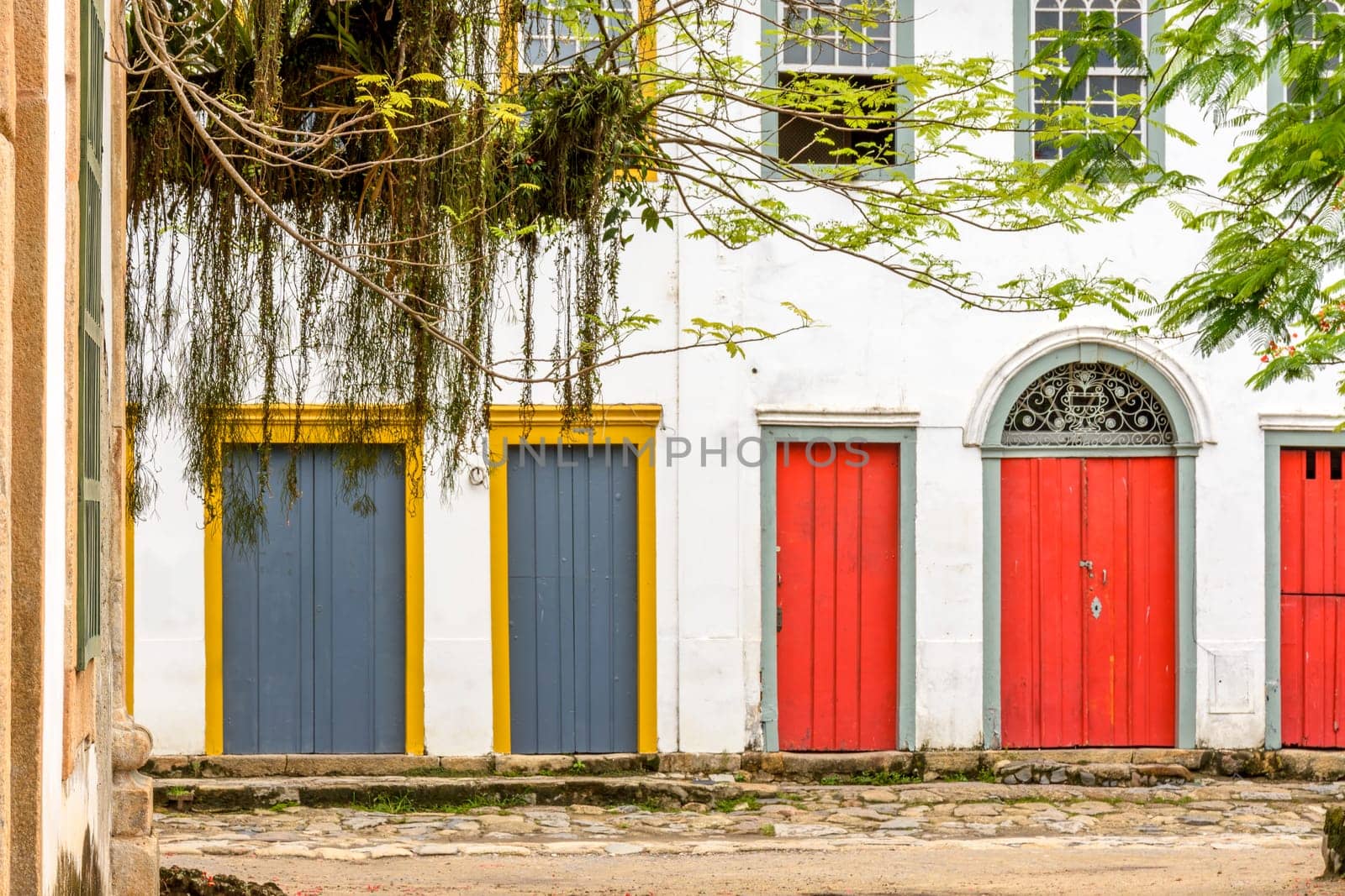 Facade of colorful houses in colonial style on the streets of the city of Paraty on the coast of the state of Rio de Janeiro