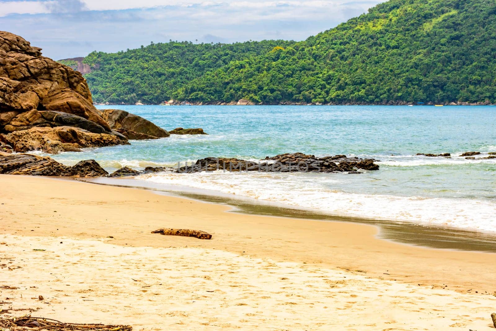 The sea between the beach, rocks and rainforest by Fred_Pinheiro