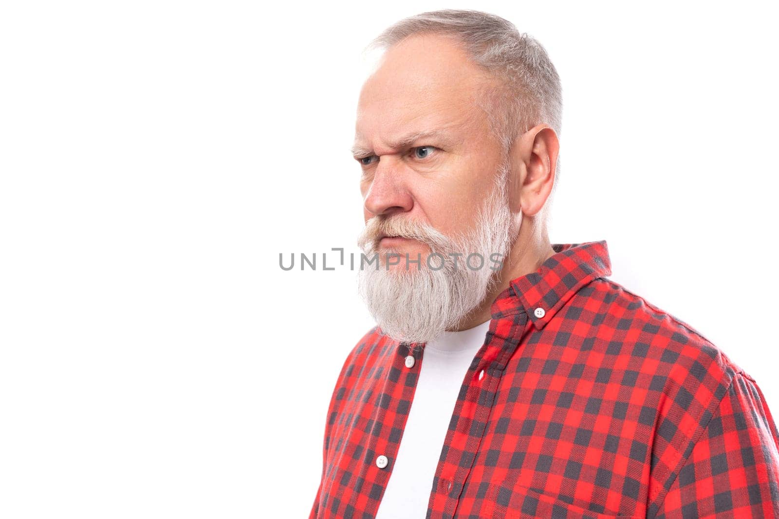 sullen 60s retired man with white beard and mustache in red shirt.