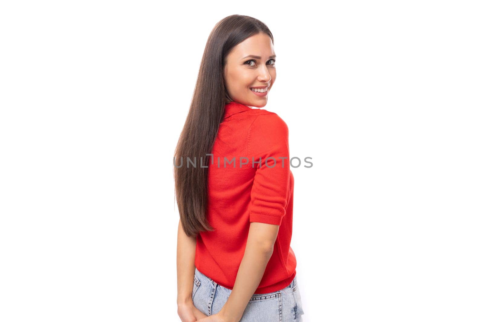 beautiful brunette woman in a red stylish v-neck blouse on a white background with copy space.