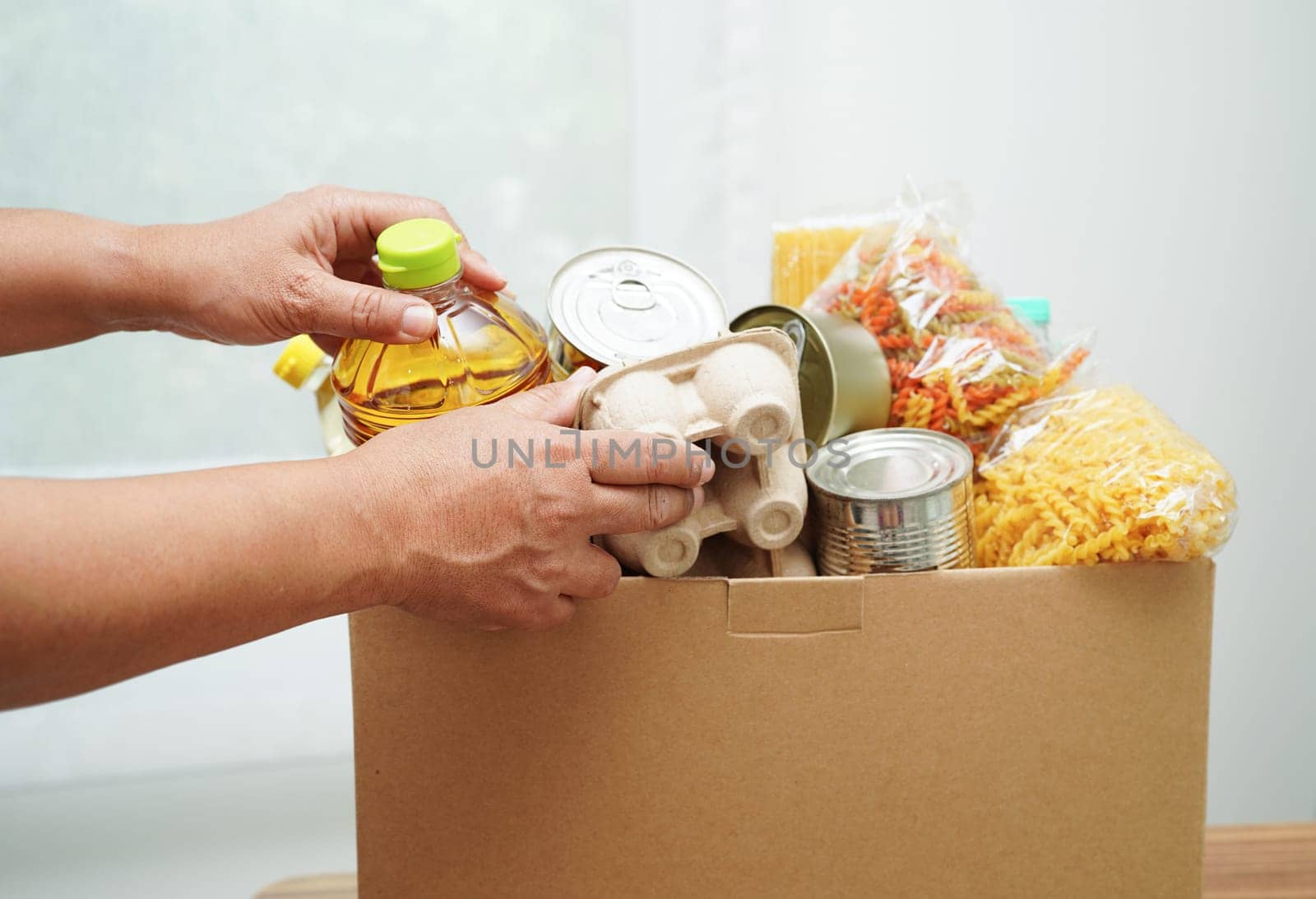 Foodstuffs in donation box for volunteer to help people.