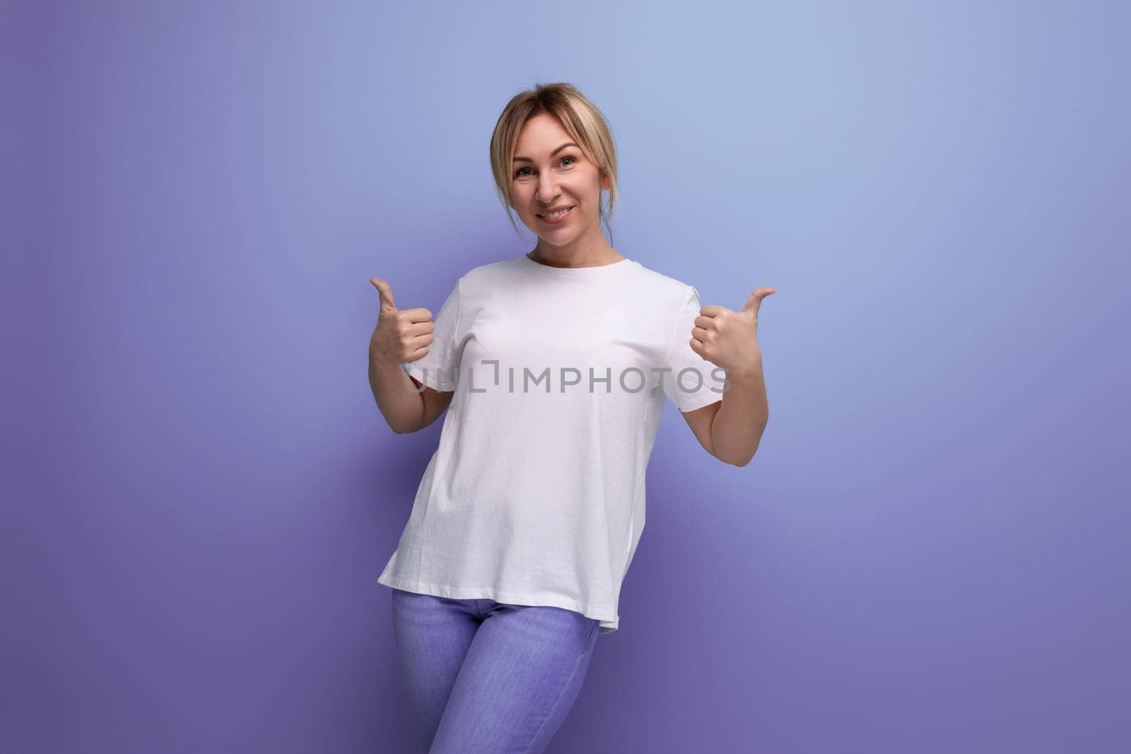 blond thin woman is dressed in a white T-shirt for printing information on it.