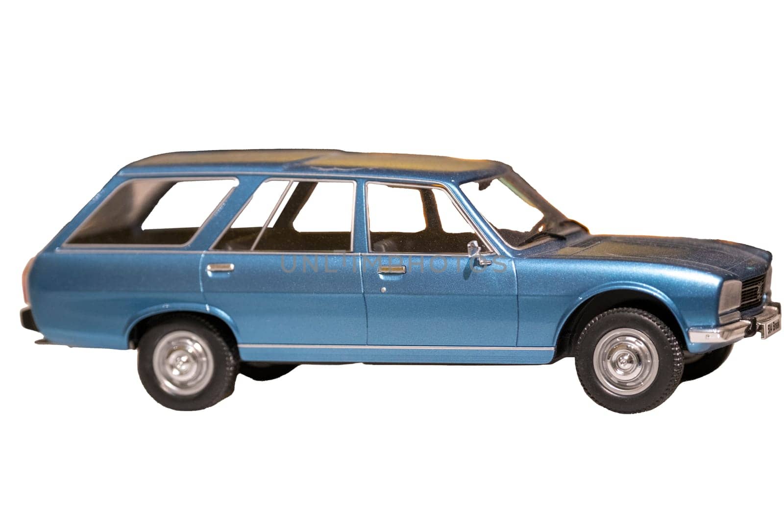 Image of an old, vintage blue station wagon model car isolated on white with a clipping path. High quality photo. Focus on foreground