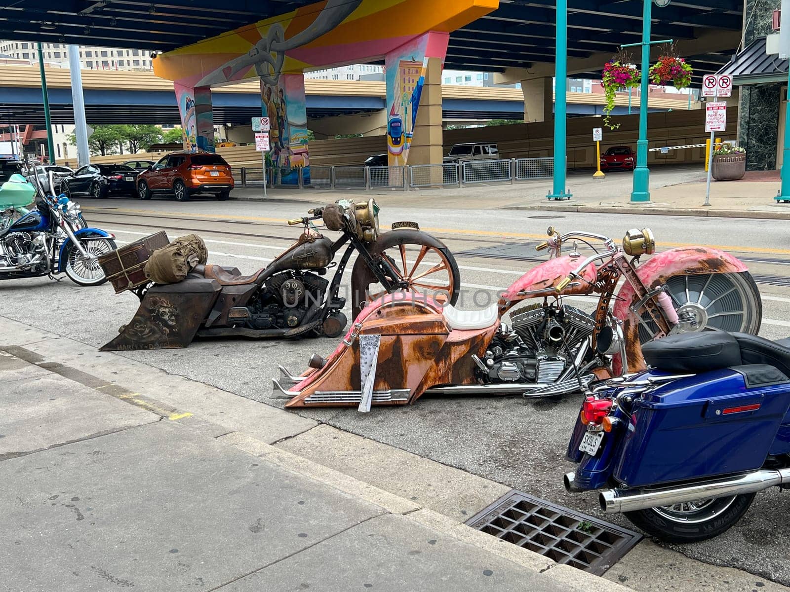 MILWAUKEE, WISCONSIN, JULY 15 2023: Downtown Milwaukee with retro customized Harley Davidsons parked outside an underpass in the city of Harley Davidson. High quality photo