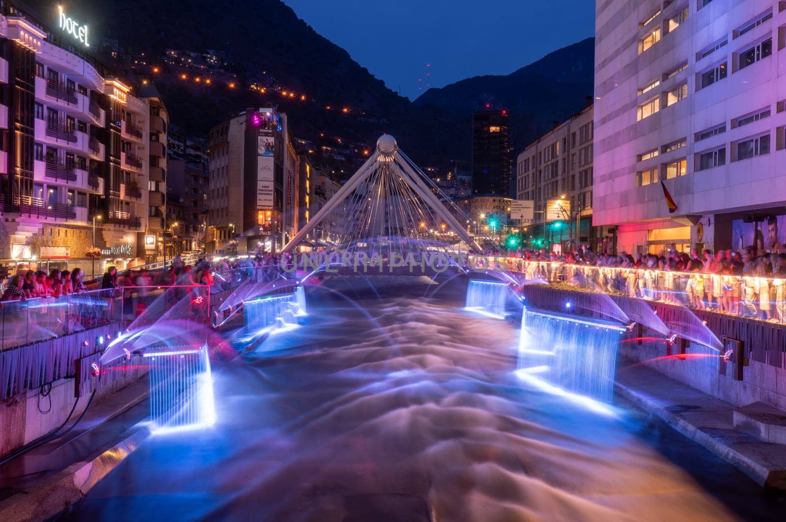 Andorra La Vella, Andorra : 2023 July 7 : Light and water show in the Capital of Andorra on the Valira River in Andorra La Vella in 2023.