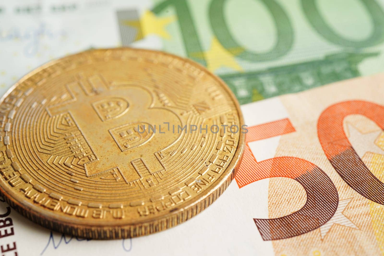 Golden bitcoin on Euro banknotes money for business and commercial, Digital currency, Virtual cryptocurrency.