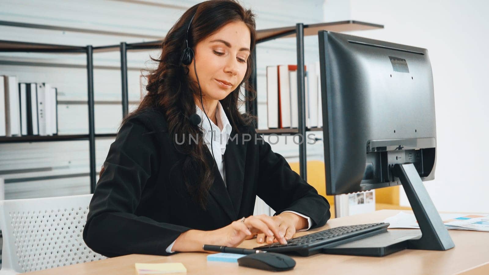 Business people wearing headset working in office Jivy by biancoblue