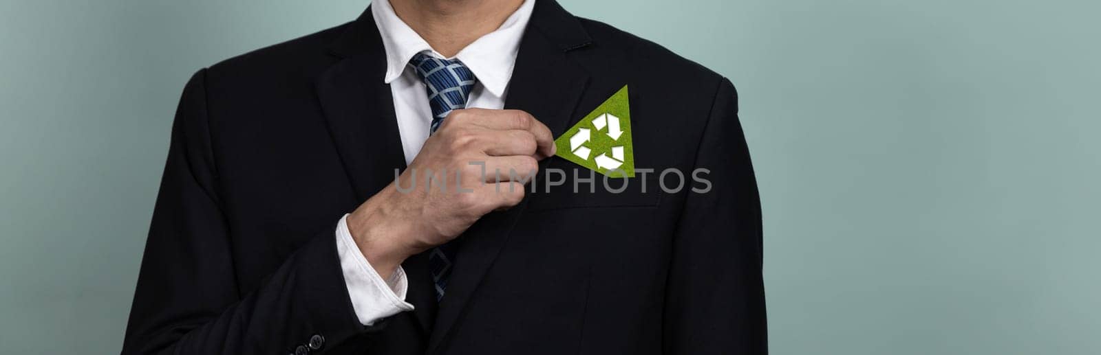 Corporate promoting sustainable and green business concept with businessman holding Recycle symbol paper as Reduce Reuse Recycle concept for waste management for clean environment idea. Alter