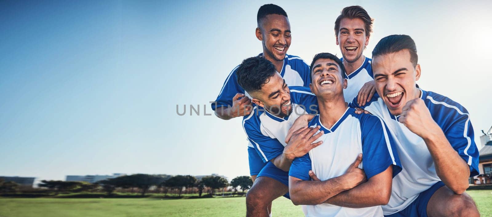 Sports, mockup and a team of soccer players in celebration on a field for success in a game. Football, fitness and motivation with man friends cheering as winners of a competition on a pitch together.