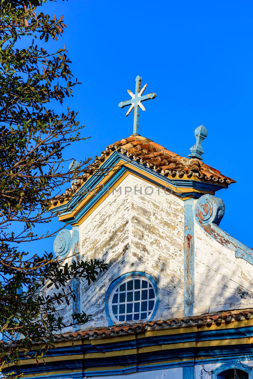 Baroque wooden church tower illuminated by the sun in the city of Diamantina, Minas Gerais