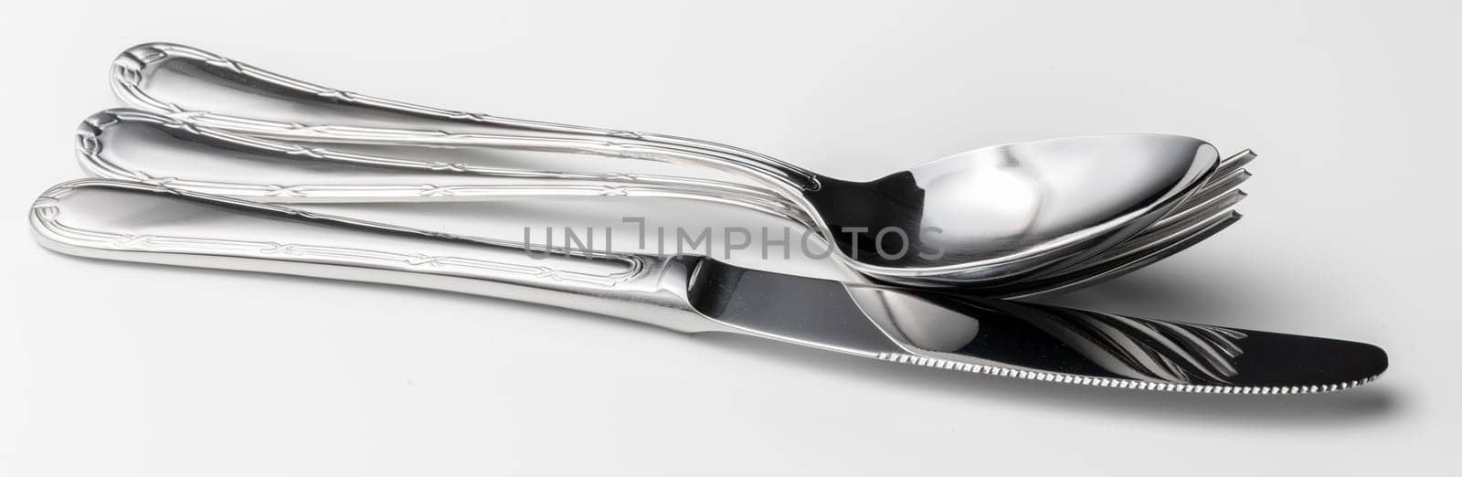 Spoon, fork and knife on a white background. High quality photo