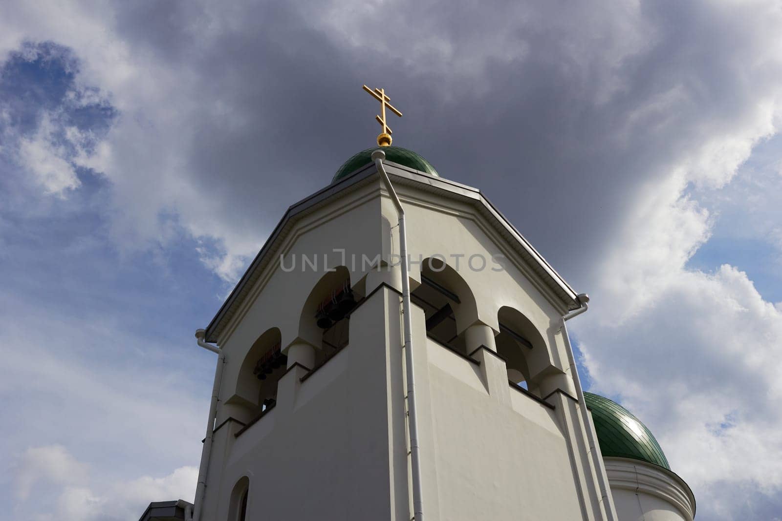 of Orthodox church, bottom view of green domes by electrovenik