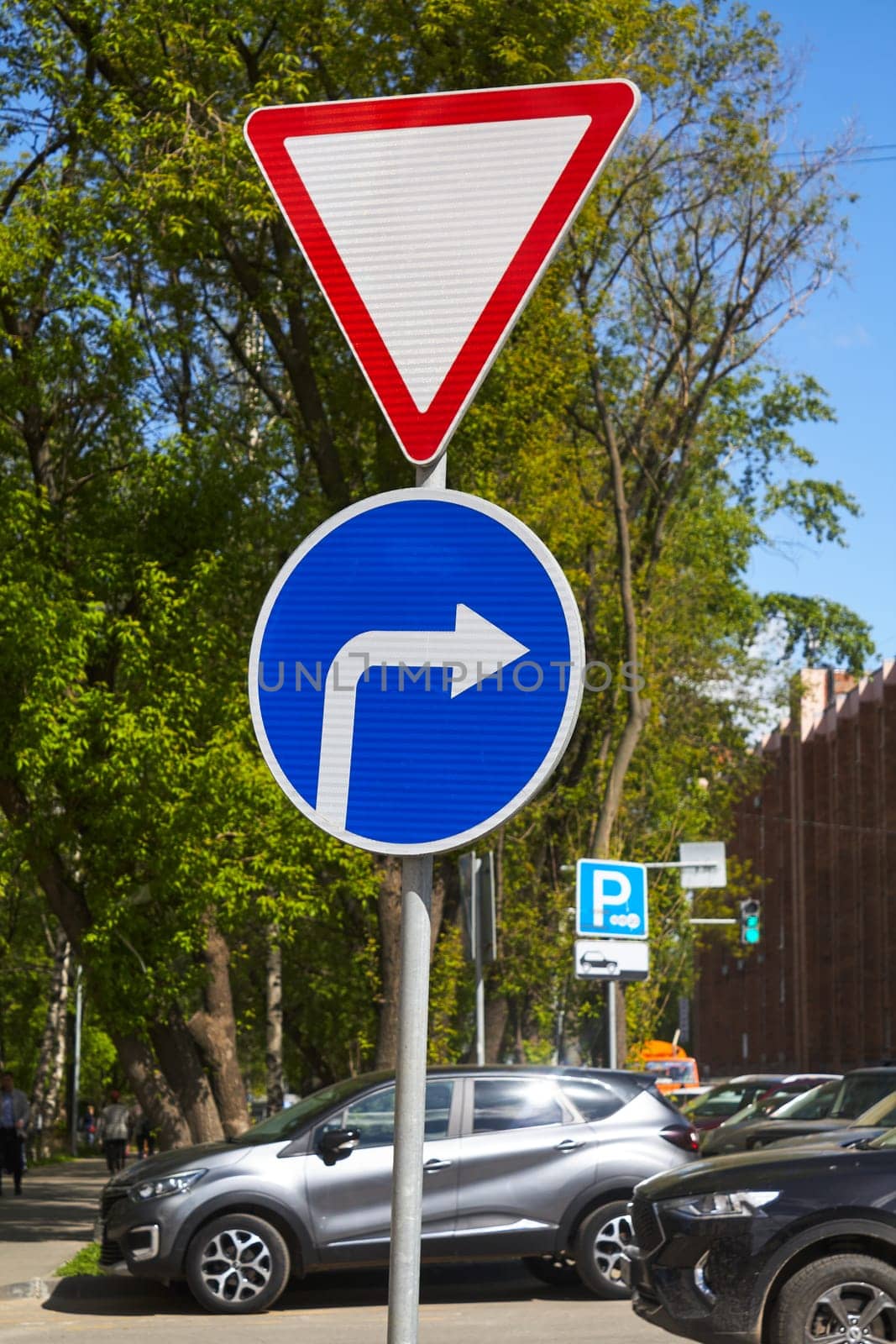 Photo of road signs move to right and give way. Traffic Laws.