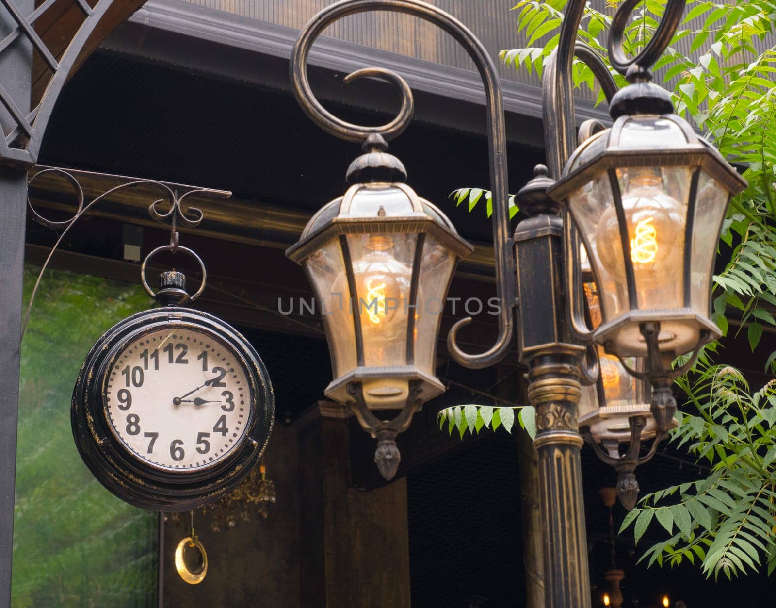 clock with three lit lanterns by Ekaterina34