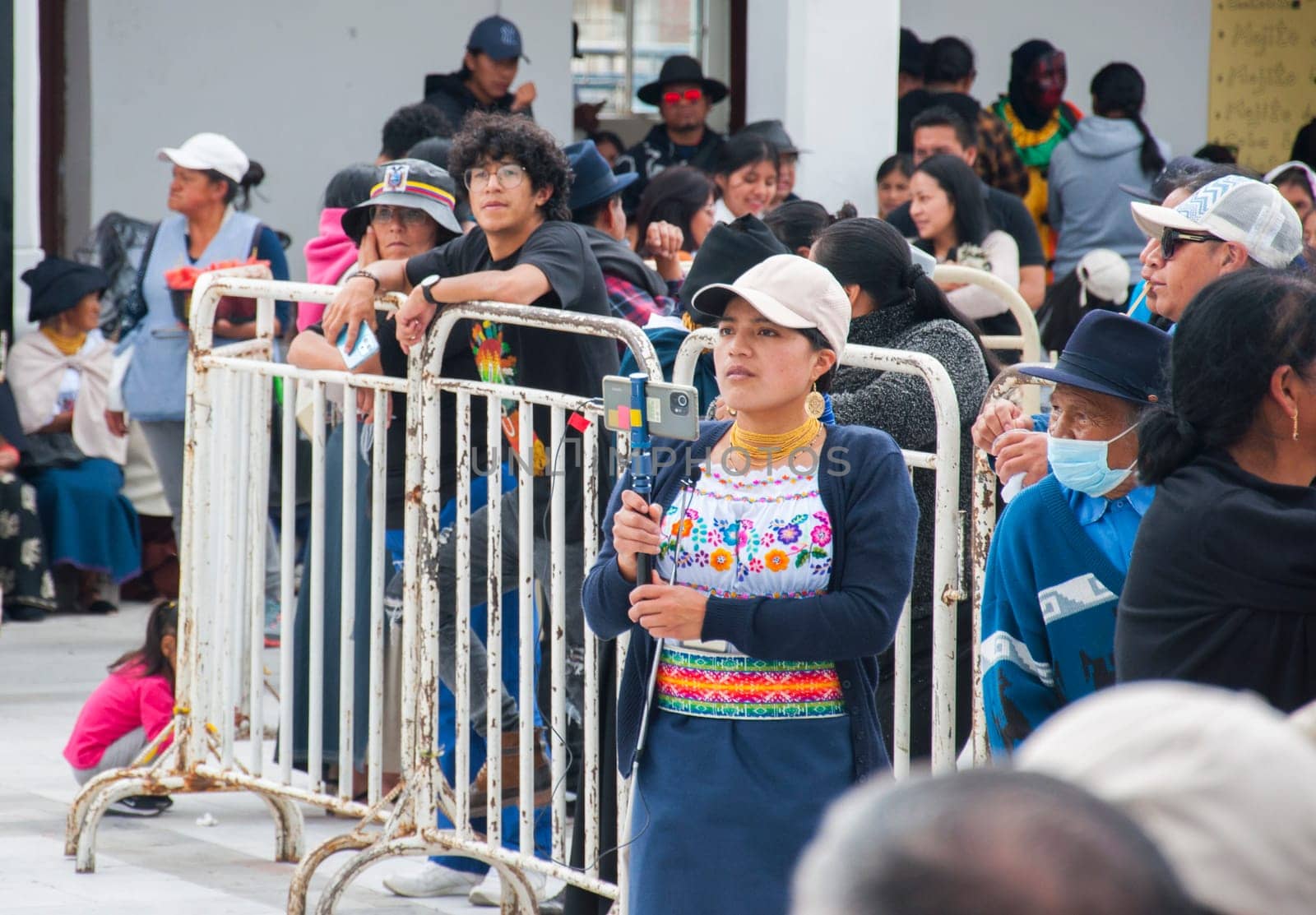 Otavalo, Ecuador - 24 de junio de 2023: indigenous reporter covering inti raymi event. High quality photo
