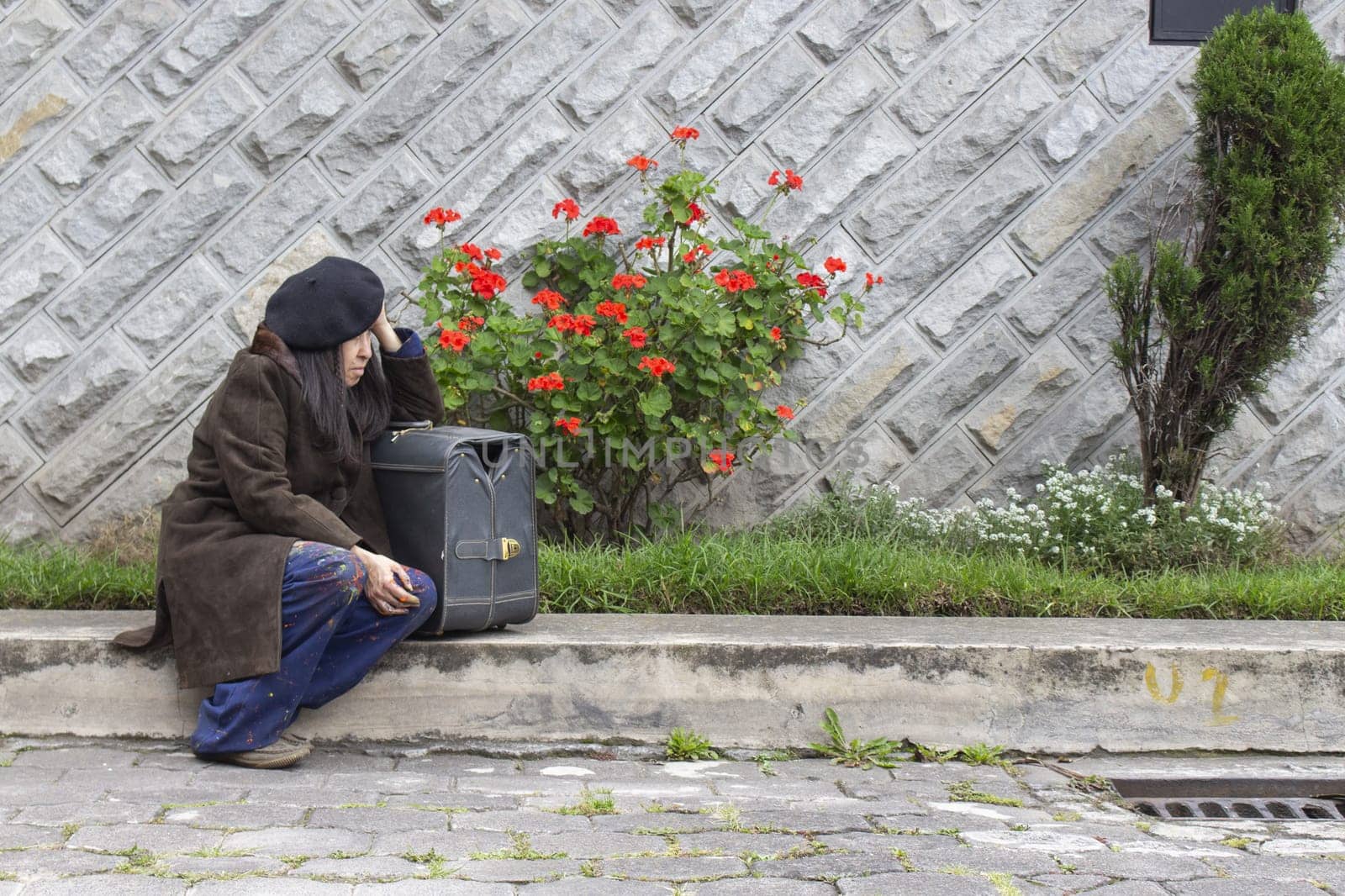 copyspace of older woman with loneliness problem with sad expression and frustration sitting on the street. High quality photo