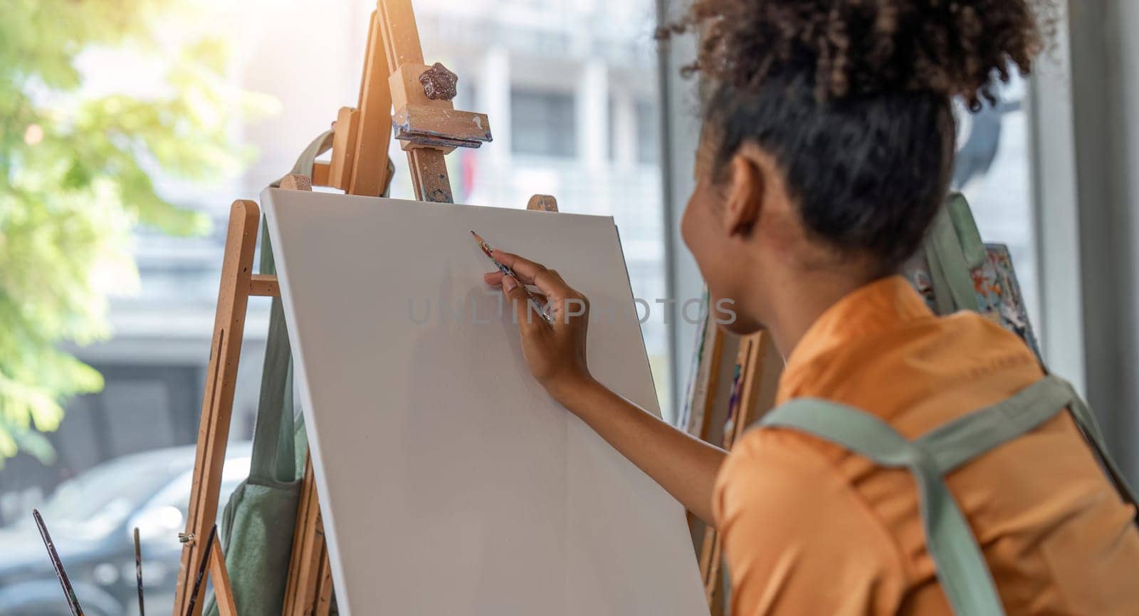 artist with pencil sketch picture at art studio.