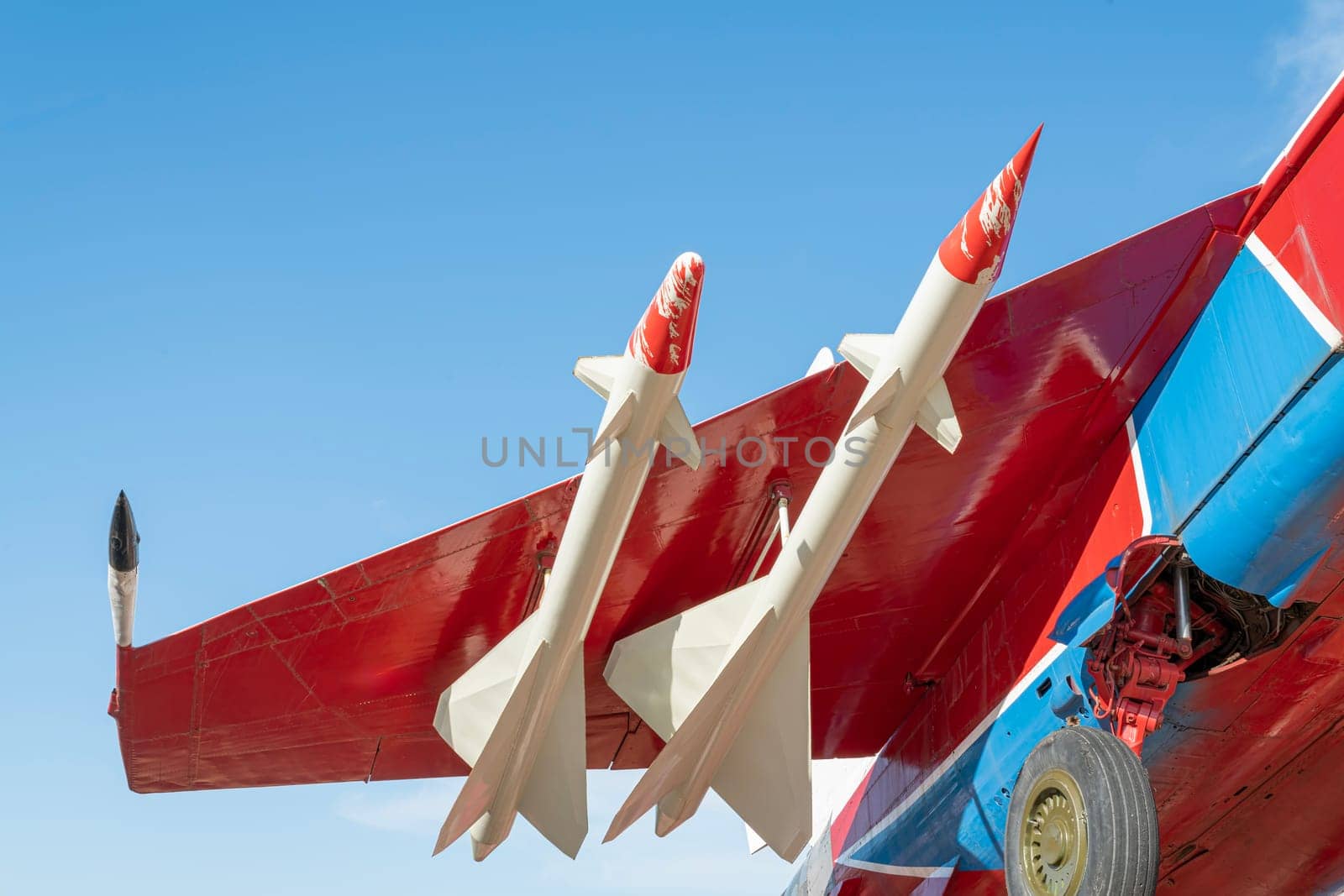 combat aircraft fighter bomber on a blue sky background. photo