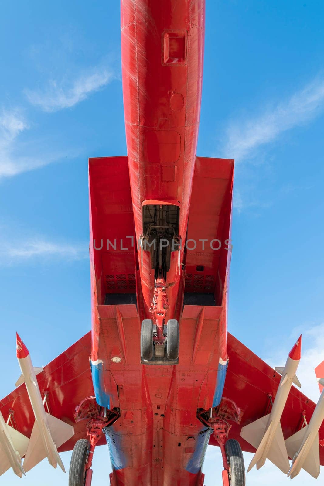 combat aircraft fighter bomber on a blue sky background. photo