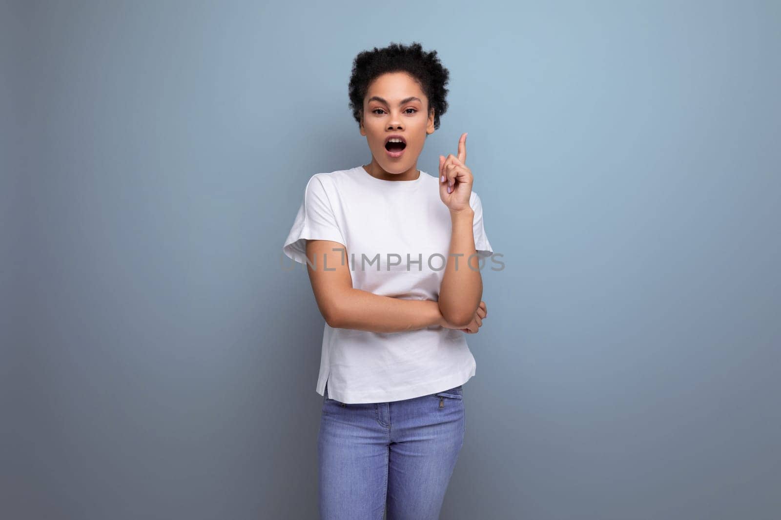 pretty woman with curly hair dressed in white t-shirt with printable mockup.