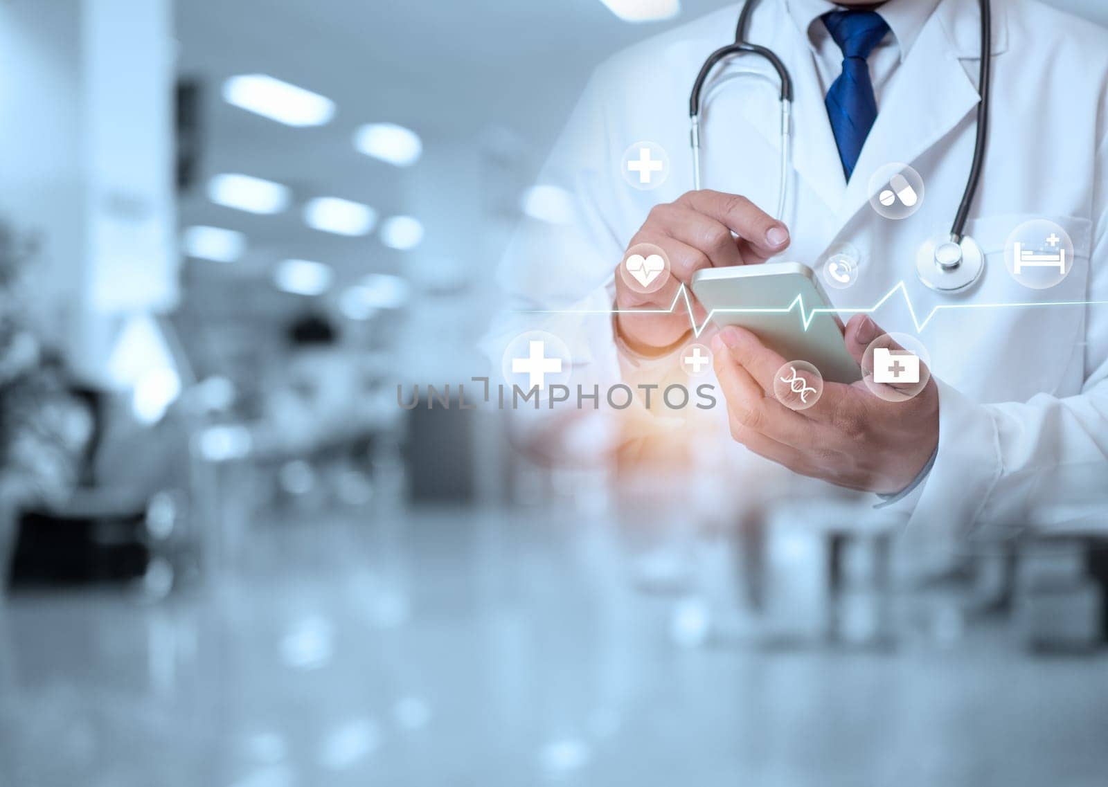 The doctor is using the phone on the background inside the hospital. Medical concept. Medical information search concept. Disease treatment concept.