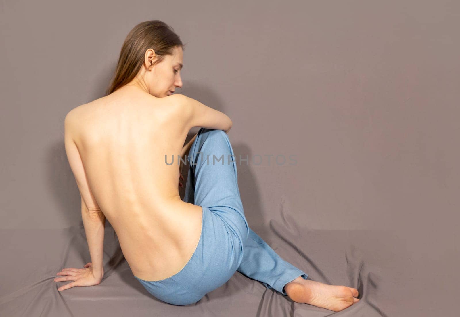 The beautiful woman's body on gray background by kajasja