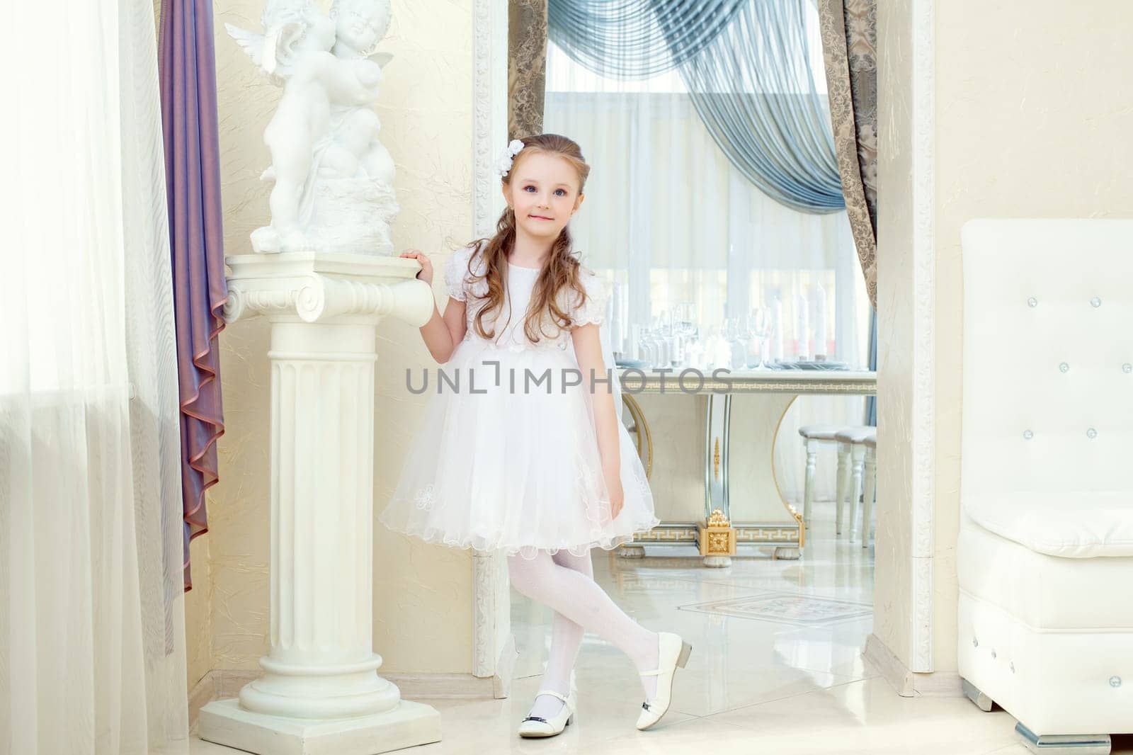 Image of adorable little girl posing in elegant dress