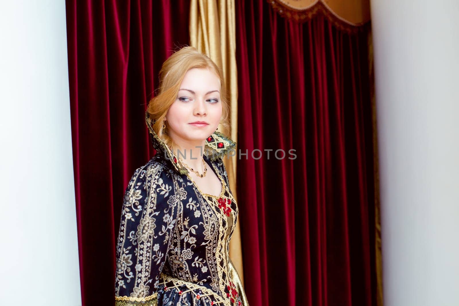 Image of beautiful young actress smiles wistfully at camera