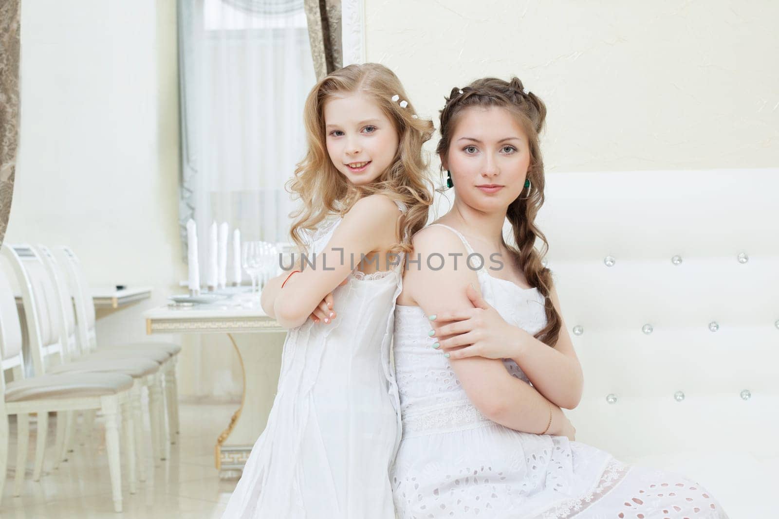 Portrait of lovely young models posing in restaurant