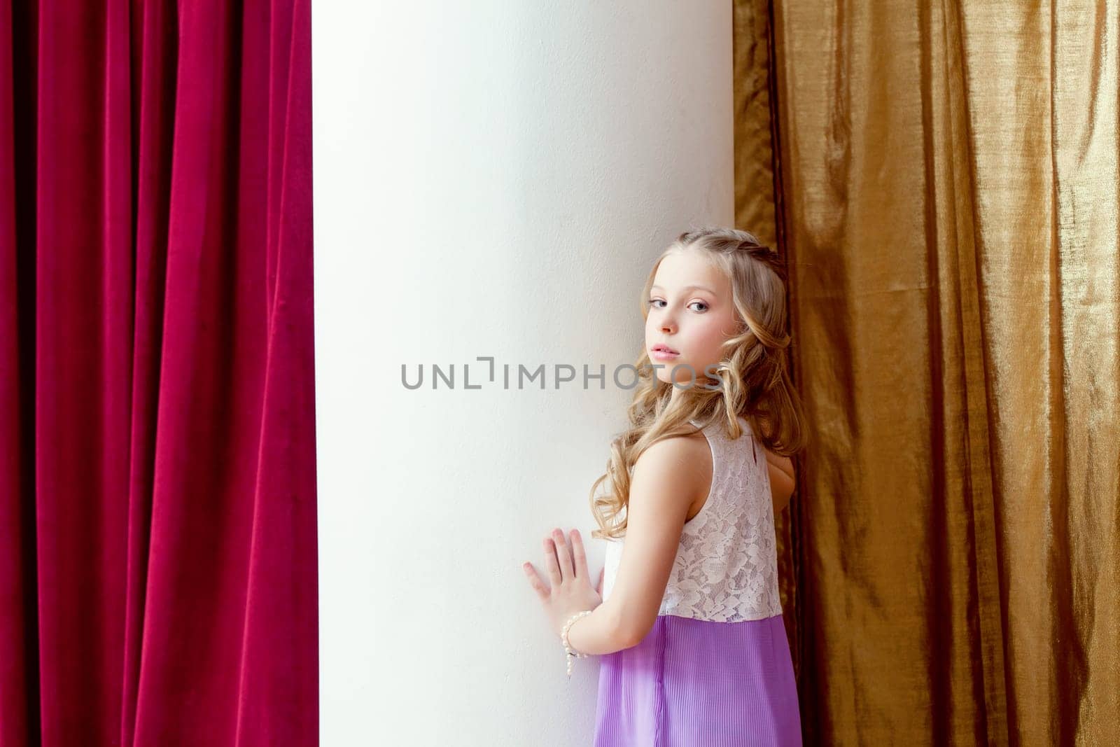 Image of cute blond little girl posing looking at camera