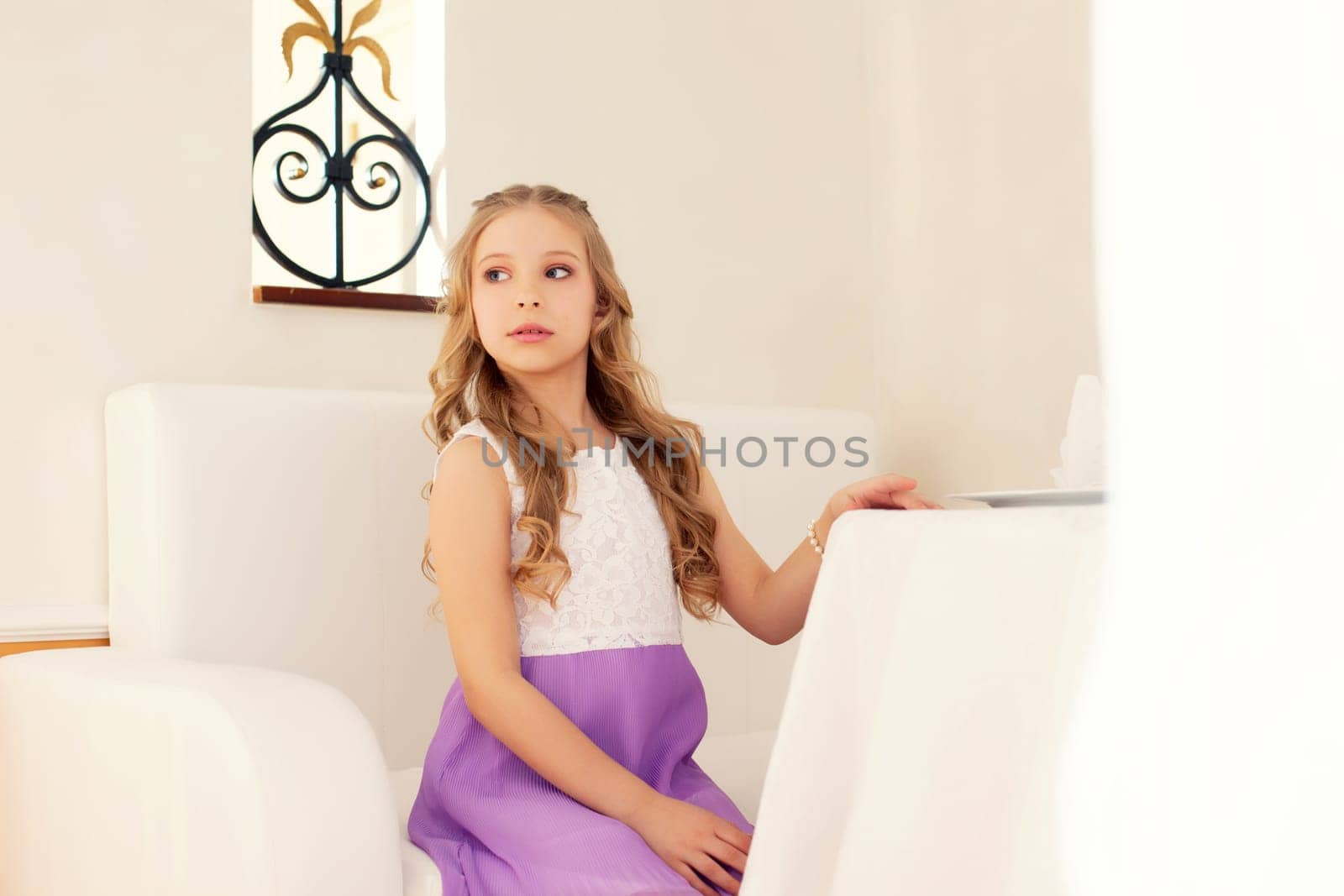 Image of lovely girl posing in modern interior