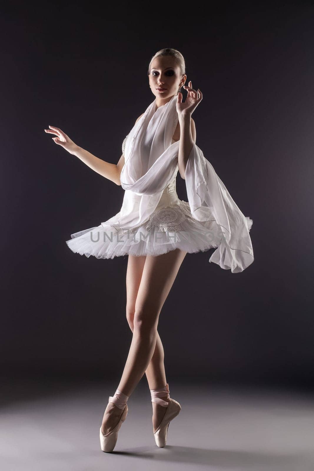 Image of adorable contemporary ballerina dancing in studio
