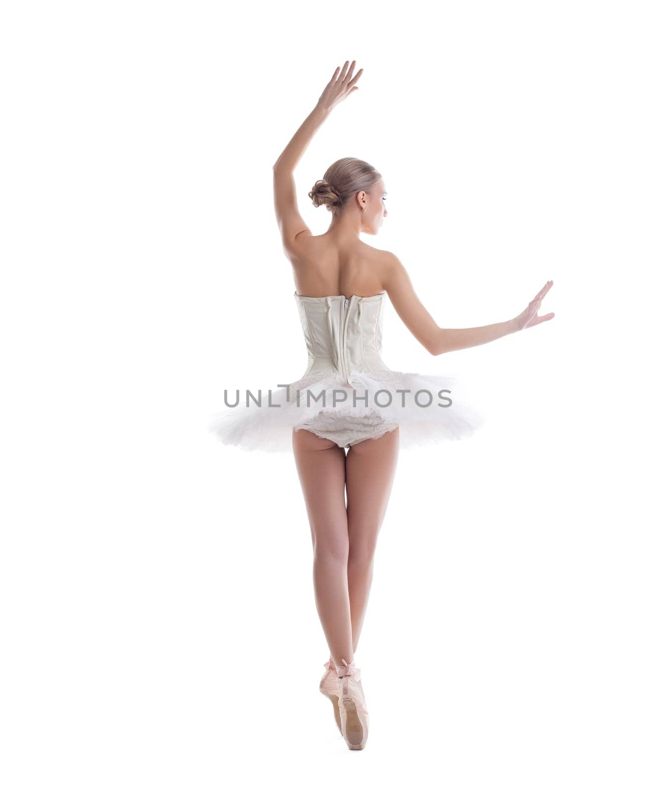Rear view of sexy ballerina, isolated on white background