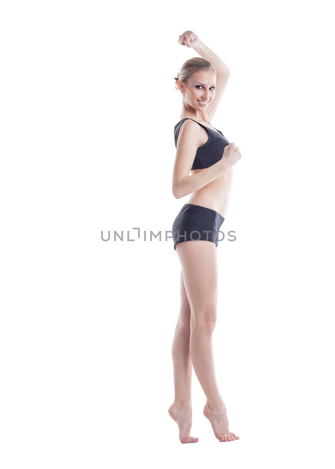 Cheerful slim girl posing looking at camera, isolated on white