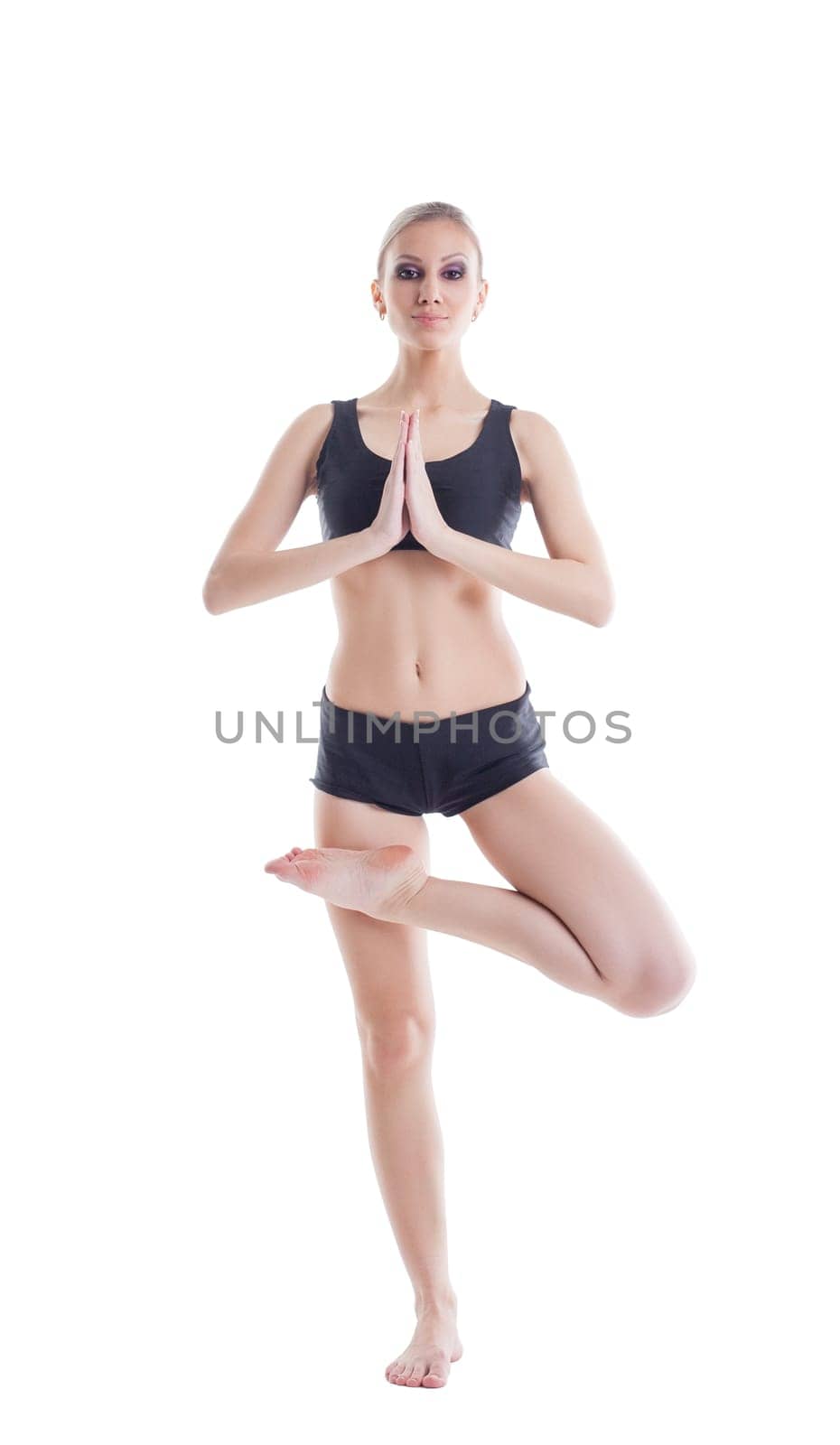 Comely young woman posing meditating at camera, isolated on white