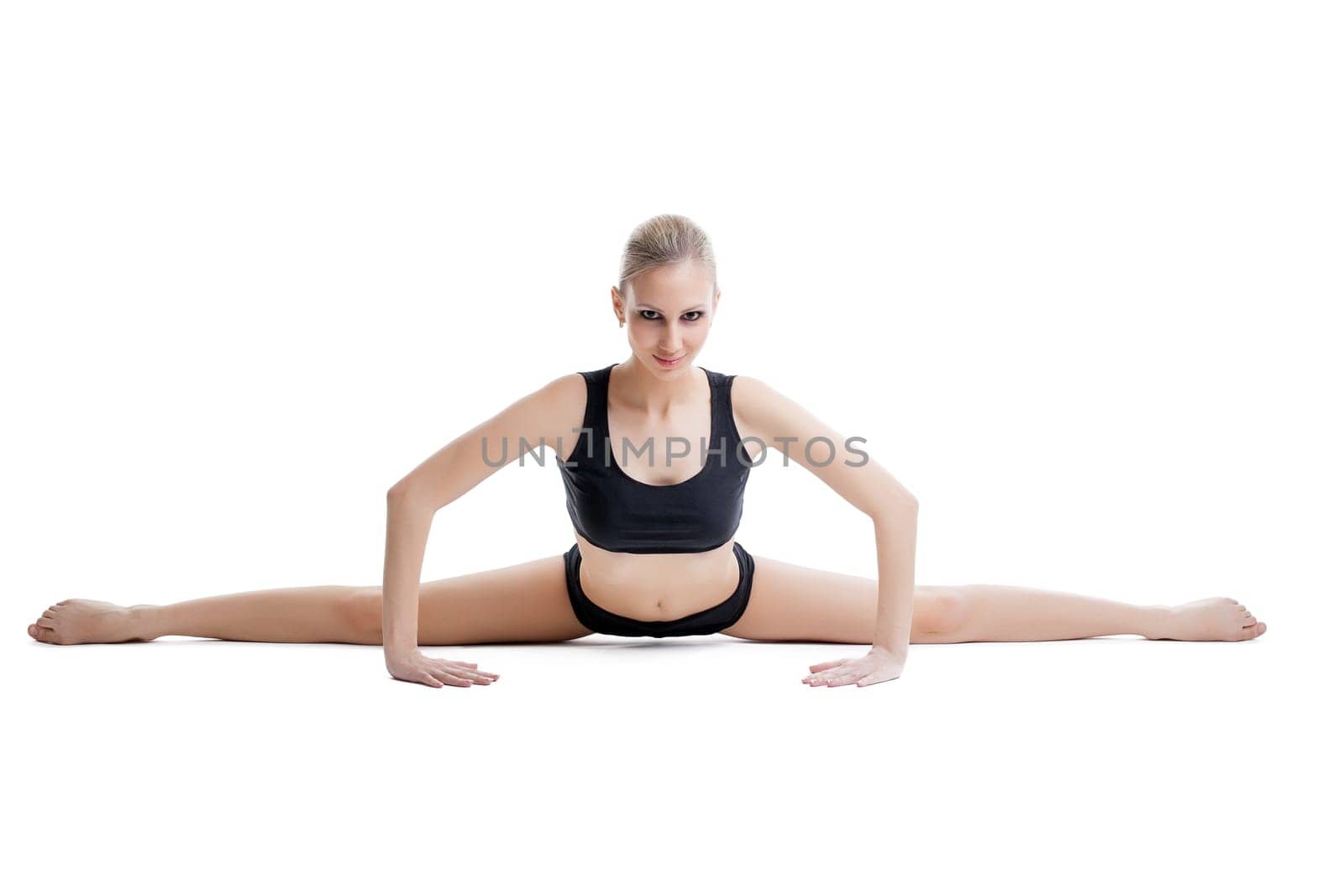 Image of pretty flexible woman doing stretching exercises
