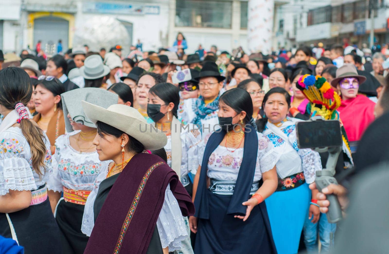 Otavalo, Ecuador - 24 de junio de 2023: indigenous people with a mask in the inti raymi parade in otavalo ecuador. High quality photo
