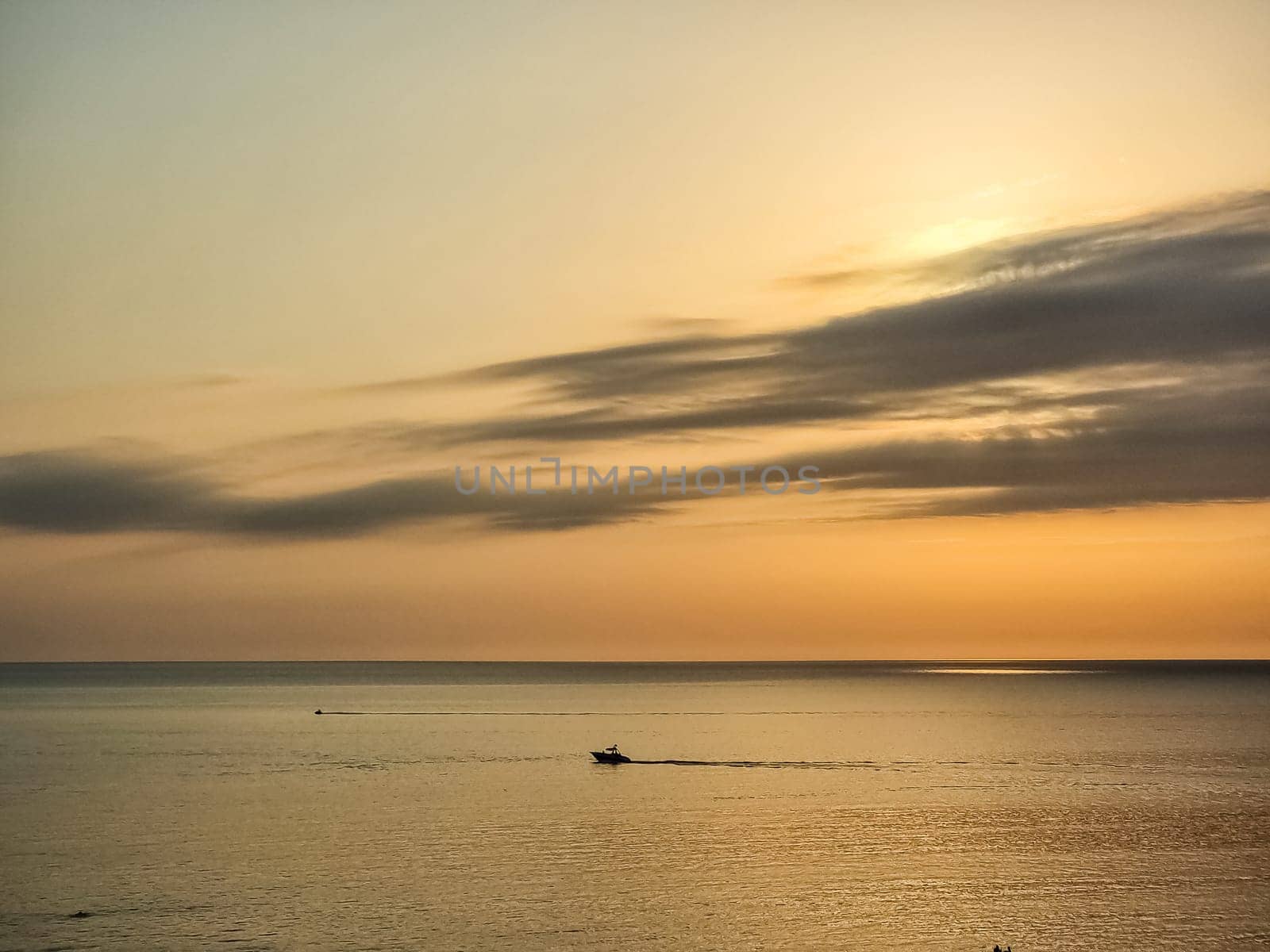 sunset at coast of the lake. Nature landscape. Nature in northern Europe. reflection, blue sky and yellow sunlight. landscape during sunset.